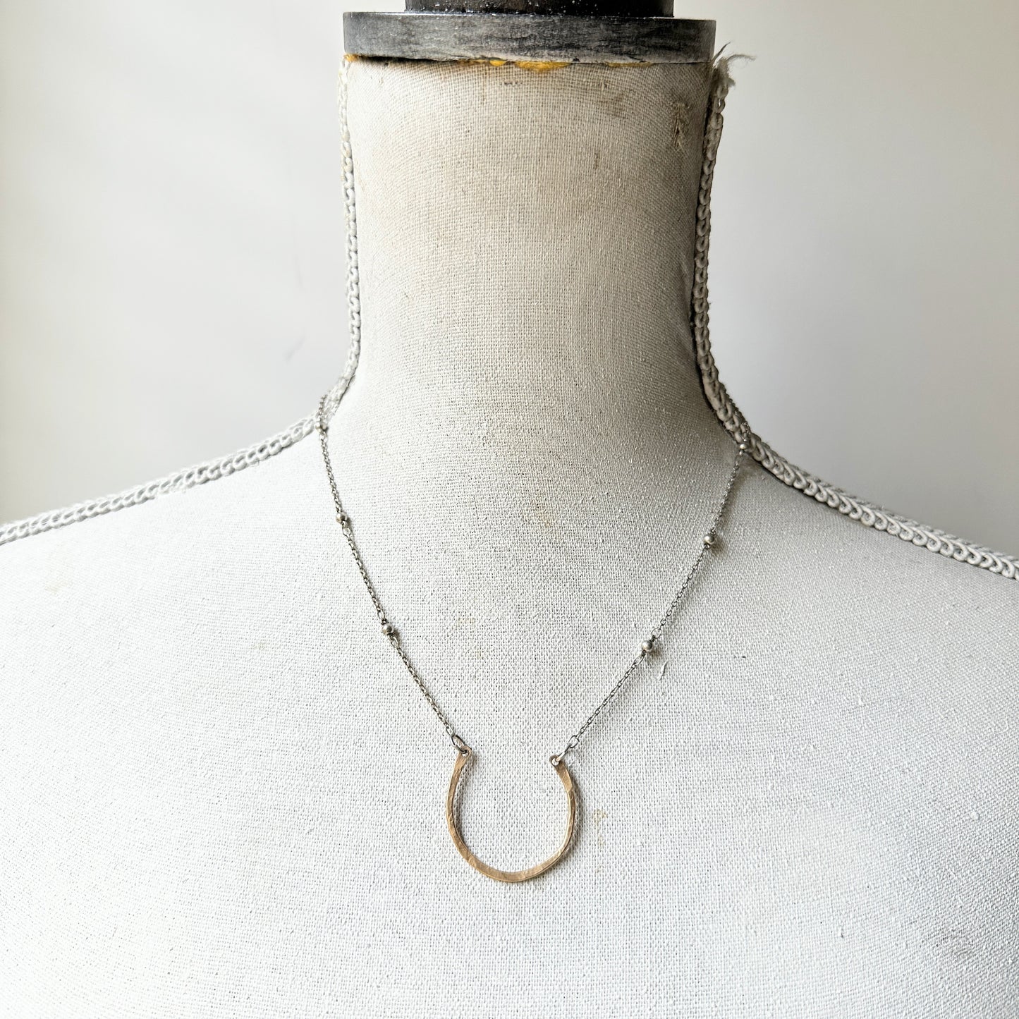 Small gold filled horseshoe necklace